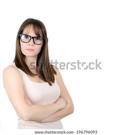 Pretty smiling young woman in black glasses with crossed arms on her chest
