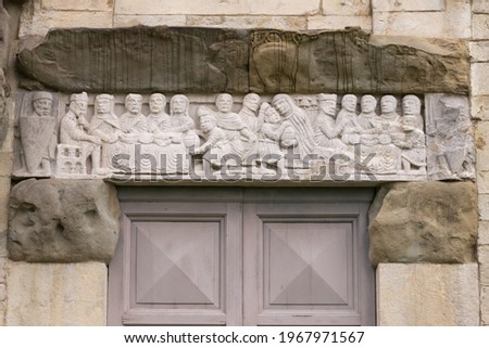 An old bas-relief above the door. Beautiful bas-relief above the entrance to the millennial temple in Barga.