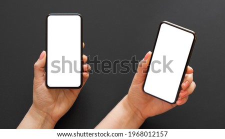 Mobile phone with empty white screen in hand in two different angles on dark background