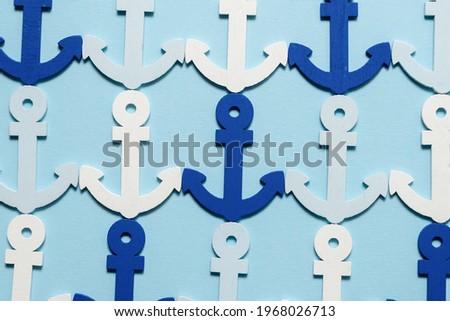 Blue anchors on a blue background. Pattern. 
