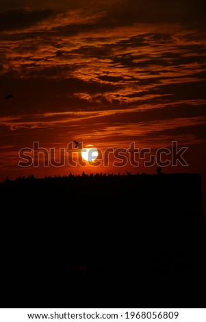 Sunset, also known as sundown, is the daily disappearance of the Sun below the horizon due to Earth's rotation. As viewed from everywhere on Earth, the equinox Sun sets due west at the moment 