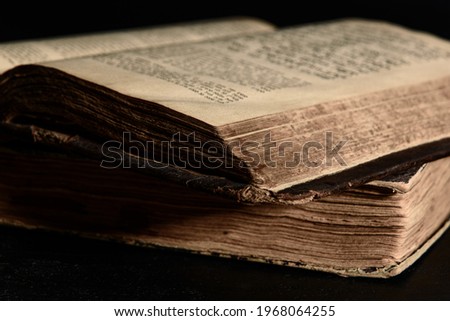 Jewish Bible. Selective focus. Old worn Jewish books. Opened scripture pages. Closeup Royalty-Free Stock Photo #1968064255