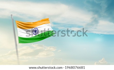 India national flag waving in beautiful sky.