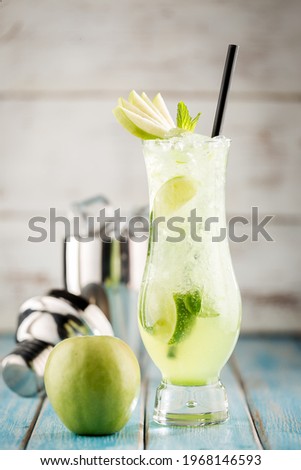 Cold Handmade Apple Frozen with Fresh Mint Leaves on wooden background