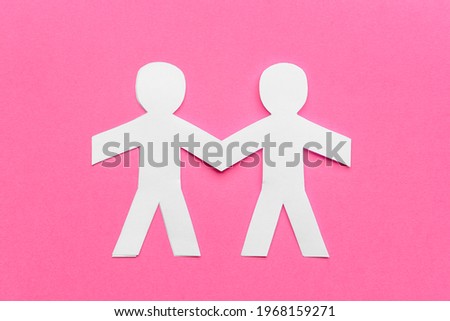 Paper human figures on color background