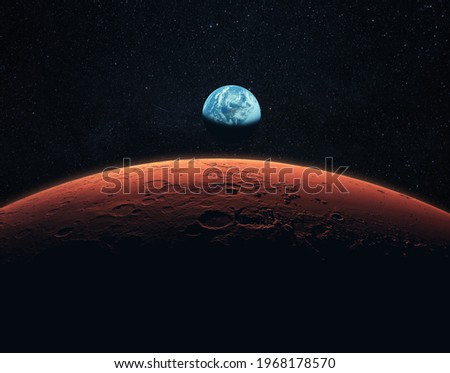Mars, the red planet with detailed surface features and craters in deep space. Blue Earth planet in outer space. mars and earth, concept  Royalty-Free Stock Photo #1968178570