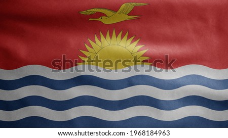 IKiribati flag waving in the wind. Close up of Kyrgyzstan banner blowing, soft and smooth silk. Cloth fabric texture ensign background. Use it for national day and country occasions concept.