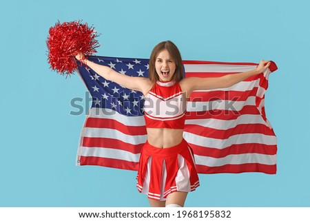 Emotional cheerleader with USA flag on color background