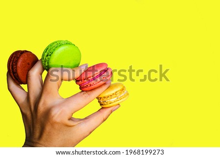 Colorful Cake Macaron With Pastel Tones Scattered On An Yellow Background.