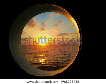 Morning sun in front of the porthole