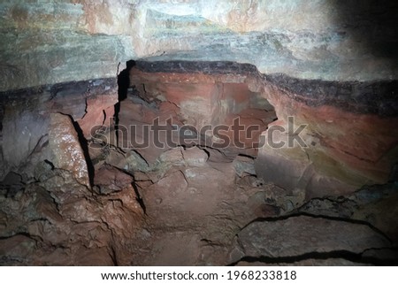 artificial cave under earth journey. wild cave, forgotten passages deep underground Royalty-Free Stock Photo #1968233818