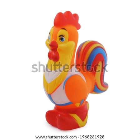 Rubber rooster toy isolated on white background