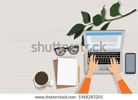 woman hand using laptop with copy space of white working table with lnote book, pencil, smartphone, cup of coffee and eye glasses. work space concept Royalty-Free Stock Photo #1968283201