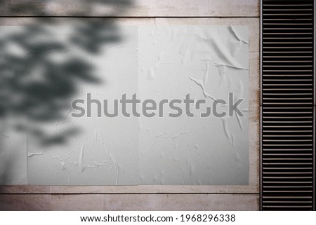 White wrinkled poster template. Glued paper mockup. Empty street art sticker mockup. Urban glued advertising canvas