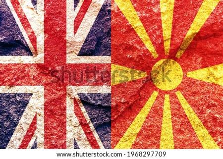 Vintage UK and Macedonia vertical national flags icon pattern isolated together on weathered solid rock wall background, abstract UK Macedonia political relationship concept texture wallpaper
