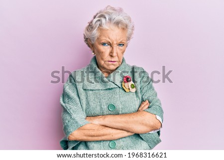 Senior grey-haired woman wearing casual clothes skeptic and nervous, frowning upset because of problem. negative person.  Royalty-Free Stock Photo #1968316621