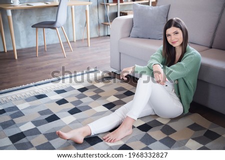 Photo of lovely peaceful girl sit floor in house