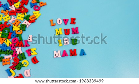 Selective foucs of an alphabet that quote Love Mother for Mother's day.  Word "IBU" in Malay means mother. 
