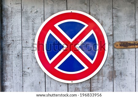 No parking traffic sign over old wooden background 