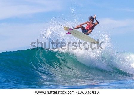 Picture of Surfing a Wave. Bali Island. Indonesia.