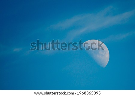 The image of the moon rises in the evening.