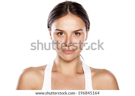 young woman without make-up with blank expression