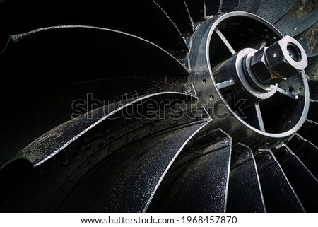 
Old riveted mine fan. Front view of the impeller and fan blades. Royalty-Free Stock Photo #1968457870