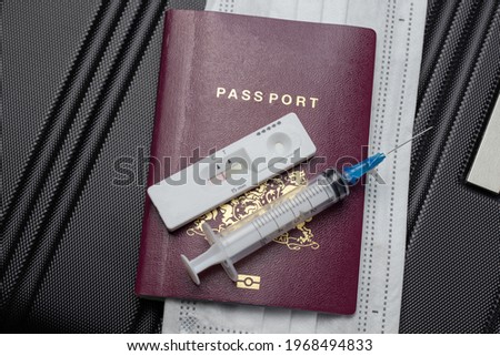 COVID-19, travel and lockdown concept,Passport with Covid-19 rapid test and syringe for vaccination Coronavirus. Traveling requirement flying holiday