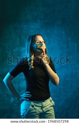 Woman in medical mask thinks about epidemic, copy space. Isolation and virus protection concept.