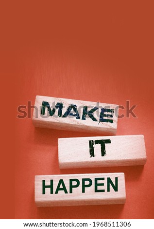 Make It Happen written on a wooden blocks. Motivation coaching career and business concept.