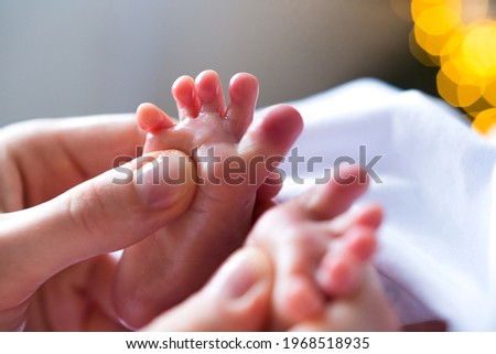 Baby and newborn details in a studio. 