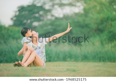 Mother And Baby outdoors. Nature.Portrait of happy loving mother