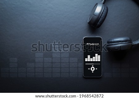 Podcast audio equipment. Audio microphone, sound headphones, podcast application on mobile smartphone screen. Recording sound voice on dark background. Live online radio player mockup banner