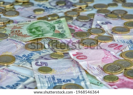 Stack of coins and paper money in close-up