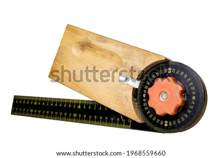 Carpentry square for measuring angles in a carpentry workshop. Accessories for carpenters to build wooden furniture. Isolated background.