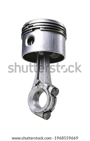 Piston and connecting rod of a small internal combustion engine. Spare parts for engine repair and regeneration.  Isolated background. Royalty-Free Stock Photo #1968559669