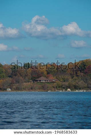 house across a lake during fall.