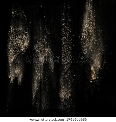 Sand falling and descending downward Royalty-Free Stock Photo #1968603685