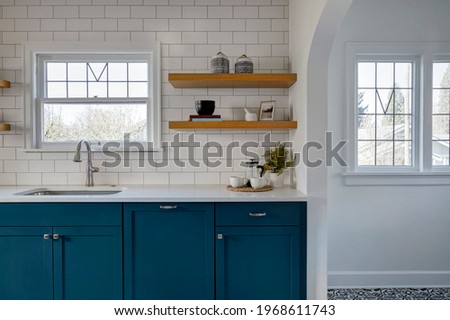 Wide view of renovated kitchen with floor detail Royalty-Free Stock Photo #1968611743