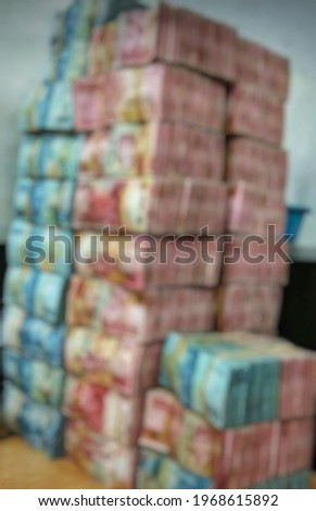 Defocused abstract background of money. Perfect for backgrounds and wallpapers about business, finance and education
