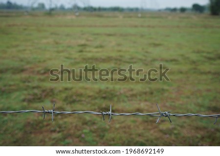 Anti-conflict barbed wire fence in Thailand