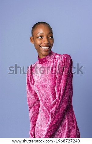 Happy black woman in a pink dress