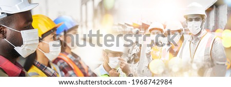 Successful industrial workers wearing anti-virus masks and uniforms standing on top of together in layers with double exposure images. Industry workers show off teamwork to prevent epidemics.