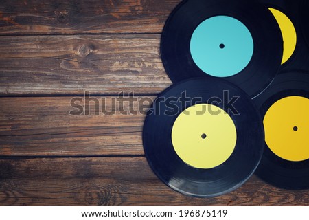 top view of records over wooden table 