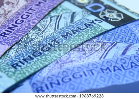 Malaysia Currency (MYR): Stack of Ringgit Malaysia bank note with isolated white background. fifty and hundred ringgit Malaysia Royalty-Free Stock Photo #1968769228