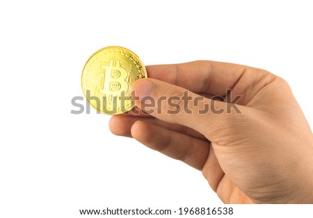 Male hand with bitcoin isolated on the white background, cryptocurrency physical symbol close up