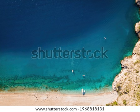 Sea coast aerial landscape of cliffs in Butterfly valley in Turkey, amazing natural beach, sunset at sea shore