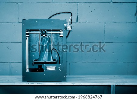 3D printer working close up. Automatic three dimensional 3d printer Royalty-Free Stock Photo #1968824767
