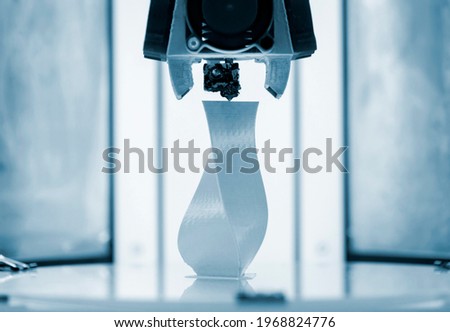 3D printer working close up. Automatic three dimensional 3d printer Royalty-Free Stock Photo #1968824776