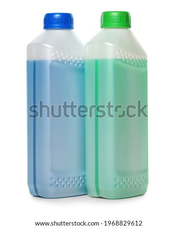 Antifreeze in plastic bottles isolated on white